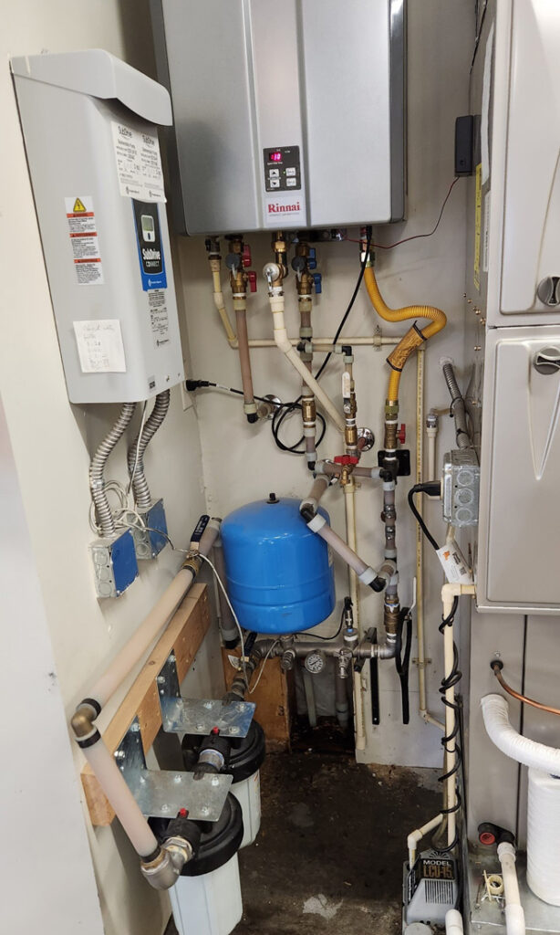 Rinnai tankless water heater installation with customized water softening filtration system.