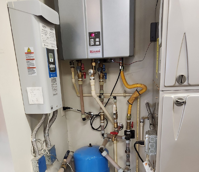 Rinnai tankless water heater installation with customized water lines.