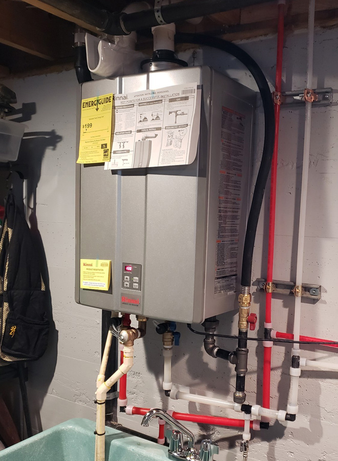 Rinnai tankless water heater replacement by Action Plumbing. Cropped photo.